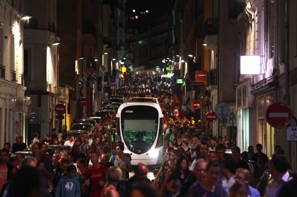 People and Trams - Angers, France (Chan collection.) Trams are for mass transit rather than rapid transit.