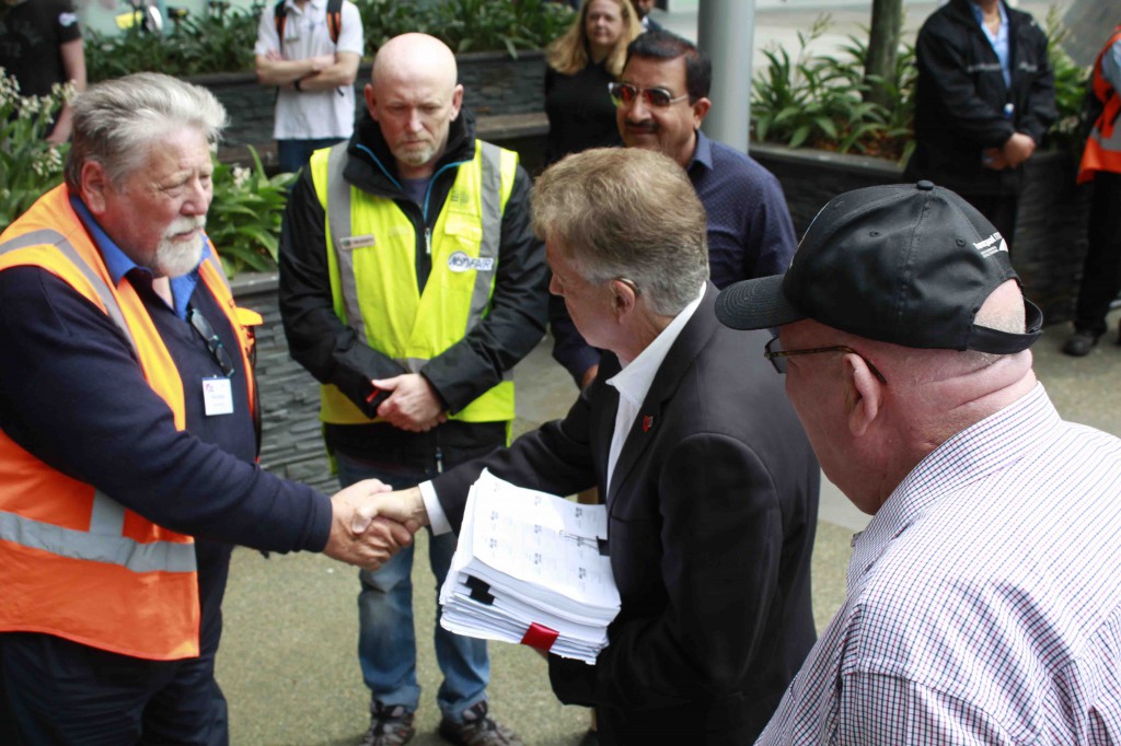 Receiving petitions outside AT head office from RMTU's Andrew Ward. From left Andrew, Phil Morgan First Union, ML, Manoj ? & Gary Froggatt Tramways Union. (Photo Jared Abbott)
