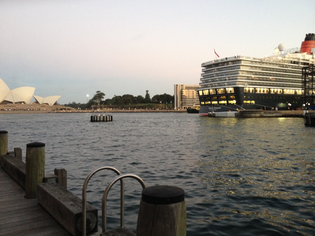 fig.1. A genuine mooring dolphin. This photograph taken in February 2015 shows the Cunard cruise ship Queen Elizabeth (294m, 2100 pax) a mid-range cruise vessel, alongside the Overseas Passenger Terminal, Circular Quay, Sydney. The dolphin is in the sea 60m from and unattached to the wharf and is navigable around. In the case of the mooring of this particular vessel it was not needed